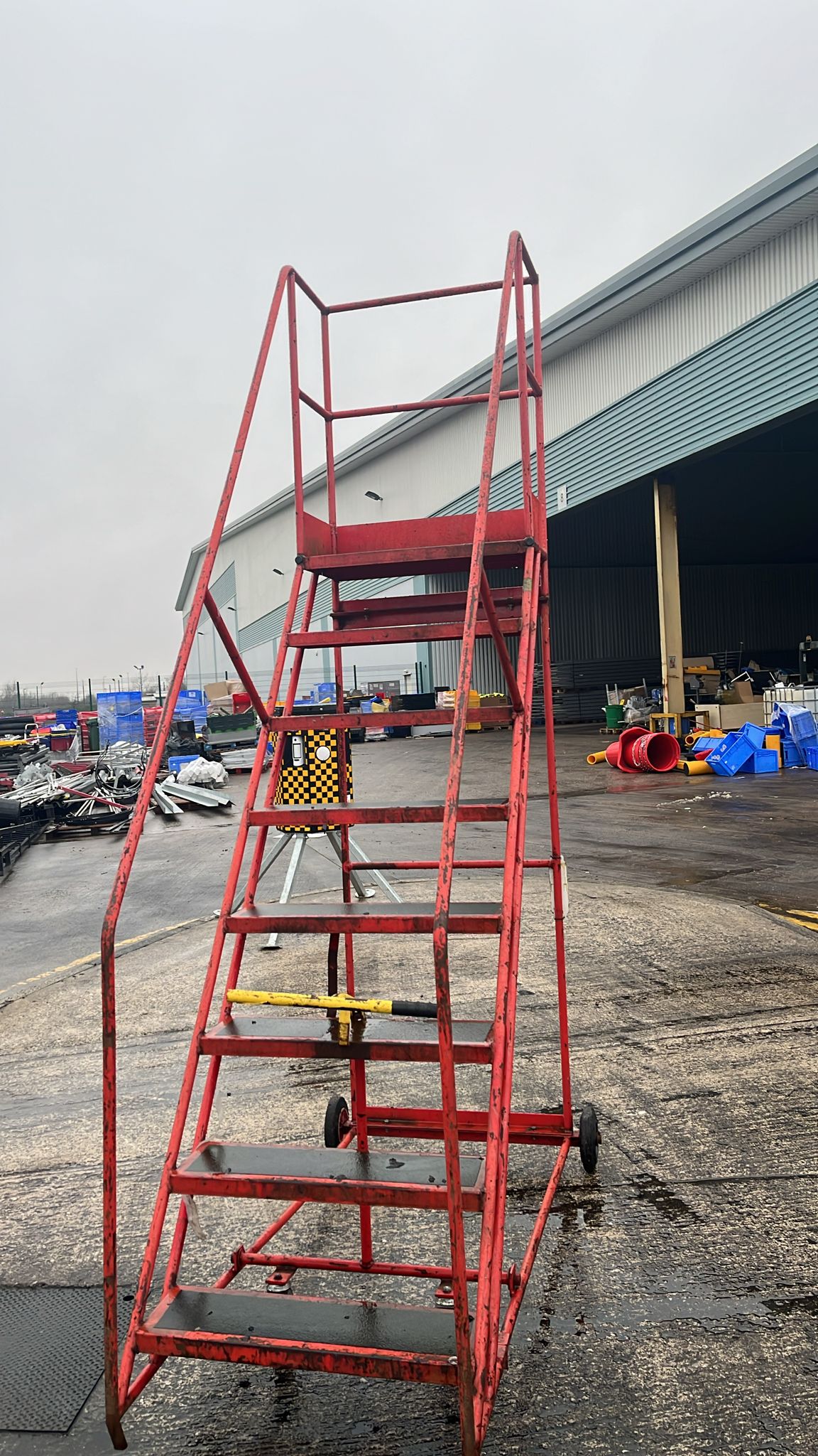 Used 8 Tread Mobile Ladder - Red