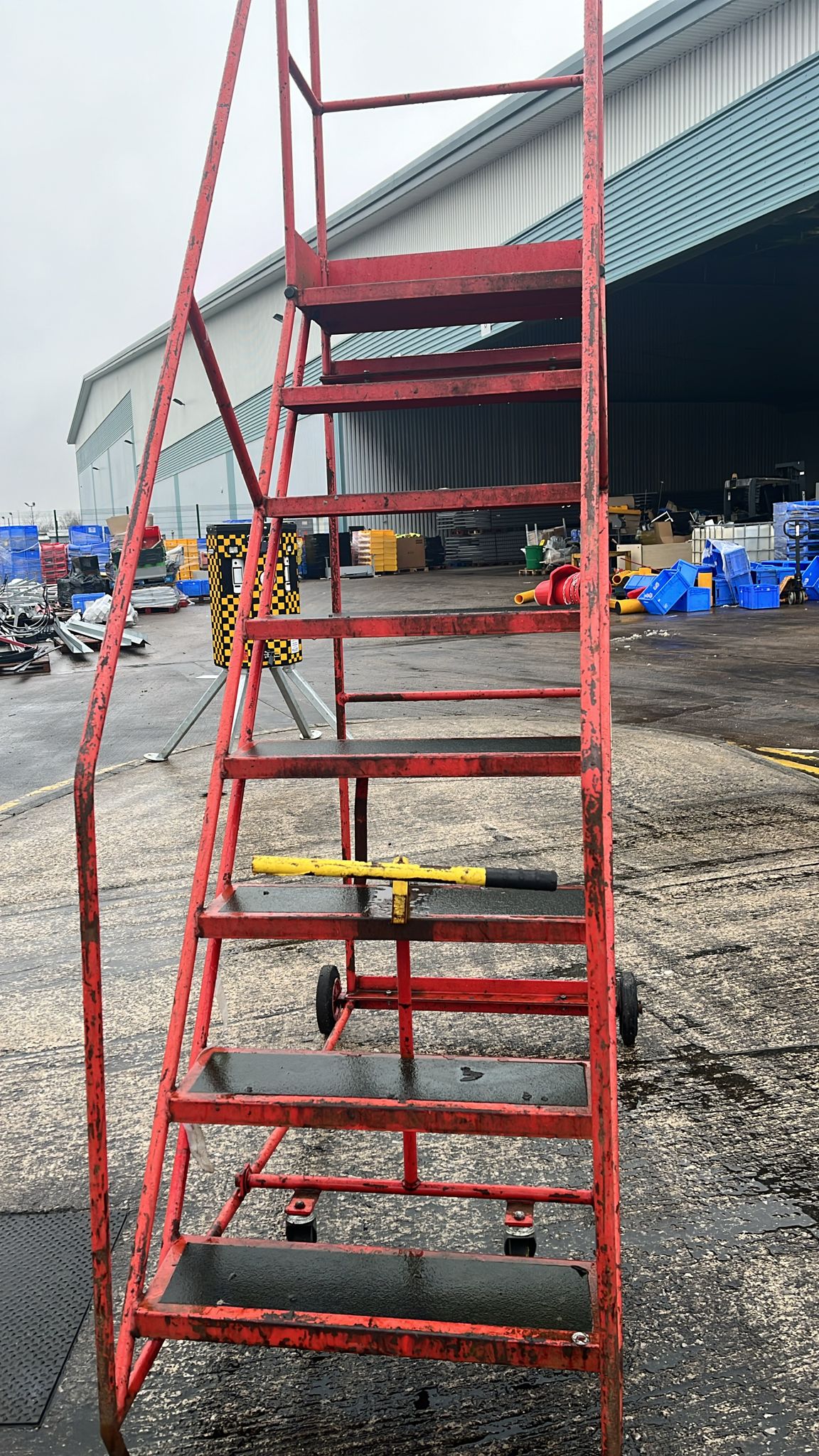 Used 8 Tread Mobile Ladder - Red